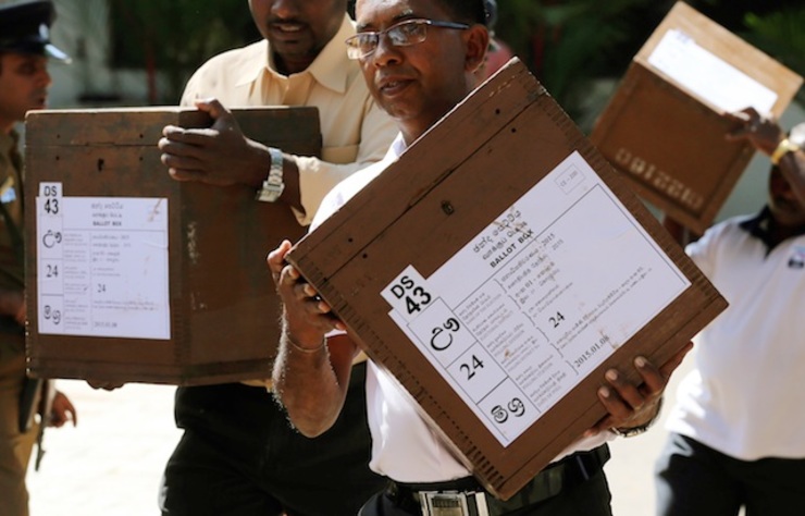 epa04549254 Election officials carry ballot boxes to polling centers one day ahead of the Presidential Elections in Colombo, Sri Lanka, 07 January 2015. The crucial Presidential election is being held two years ahead of its due date. According to the Elections Secretariat, over 15 Million are elegible to vote at about 12,000 polling centers on 08 January to elect the seventh President for another six years.  EPA/M.A. PUSHPA KUMARA