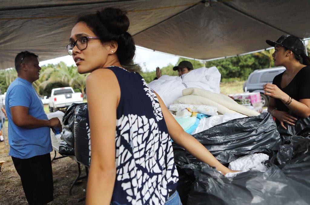 PAHOA, HI - MAY 05: Volunteers set up a tent to distribute goods to evacuees beside a roadblock near volcanic activity on Hawaii's Big Island on May 5, 2018 in Pahoa, Hawaii. A magnitude 6.9 earthquake struck the island May 4 along with new eruptions from the Kilauea volcano. The volcano has spewed lava and high levels of sulfur gas into two nearby communities, leading officials to order 1,700 to evacuate in the area. (Photo by Mario Tama/Getty Images)